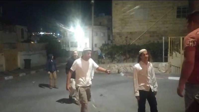 Israeli Settlers, Backed by Regime Forces, Stab Palestinian Man in Al-Khalil